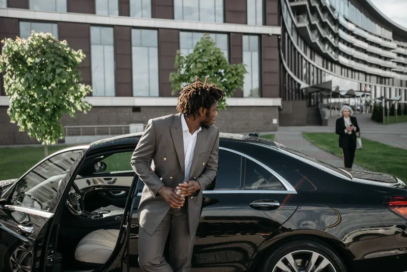 The Signal You Send Before You Speak: Ground Transportation as a Currency of Professional Reputation
